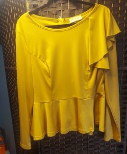 Yellow goldtone peplum long sleeve top.